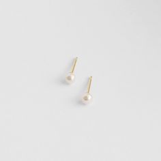 Part of our SS22 Solid Gold Collection. 3mm round pearls, each hand-selected, in a high-luster white -- check out the zoomed in model photos for a great representation of how beautiful these pearls are. A classic pearl earring in a super versatile size. Studs are solid 14k gold, and they ship with 14k gold fill backings. Classic Pearl Earrings, Pearl Earring, Gold Collection, Gold Studs, Model Photos, How Beautiful, Solid Gold, Gold Filled, Pearl Earrings