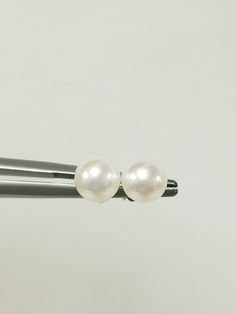 "Thanks for shopping our vintage estate store. We tend to sell well below wholesale and truly hope you enjoy all of our items. Many of the items are one of a kind, so please enjoy scrolling through the pictures and hopefully something will catch your eye. Brown spots are from camera. Nice estate 14k white gold natural pearl studs. Freshwater cultured pearls, custom made for our store. Size: 6mm 1/4\" Weight: .93 gram Earring backs are included. Freshwater pearls takes 4 to 6 years to be develope Classic White Pearl Earrings, Classic White Round Cut Pearl Earrings, Classic Round Pearl Earrings For Anniversary, Classic Pearl Earrings For Anniversary, Classic Round Formal Earrings, Classic Hypoallergenic Round Cut Jewelry, Classic Silver Pearl Earrings, Classic Nickel-free Sterling Silver Pearl Earrings, Classic Sterling Silver Nickel-free Pearl Earrings