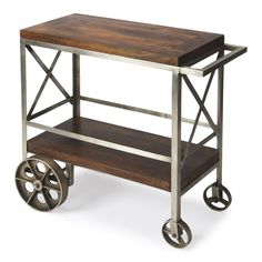 a wooden and metal cart with wheels