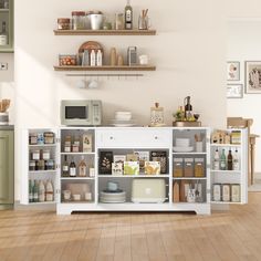 a kitchen with lots of shelves and dishes