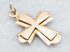 This beautifully crafted cross adds a classic touch to any look. Made with solid yellow 14-karat gold, this timeless piece features a stunning cross that adds a touch of faith and sophistication.This pendant does not come with the chain shown. Please feel free to contact us, we will help you find the perfect chain for your style and budget!Metal: 14K Yellow GoldMeasurements: 19 x 27 mm, with bail Polished Cross Necklace For Formal Occasions, Yellow Gold Polished Cross Necklace Pendant, Formal Polished Cross Necklace, Classic Polished Crucifix Cross Necklace, Formal Polished Cross Pendant Necklace, Classic 14k Gold Crucifix Jewelry And Charms, Classic 14k Gold Crucifix Jewelry, Polished 14k Gold Cross Jewelry, Polished Yellow Gold Cross Jewelry