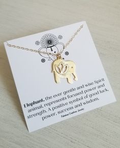 The Elephant, the ever gentle and wise Spirit animal, represents focused power and strength. A positive symbol of good luck, power, success and wisdom. Wear this good luck necklace as a reminder of your own inner strength. The cutest little elephant with a lotus flower cut out floats on shimmering Gold Filled chain in your choice of length. Each elephant pendant has a brushed finish and measures about 1 inch. Details: * Brushed Gold Elephant with a Lotus Flower Cut Out is 14 k gold plated over b Elephant Meaning, Positive Symbols, Gold Elephant Pendant, Elephant Necklace Gold, November Birthstone Necklace, Luck Necklace, Flower Cut Out, Good Luck Necklace, Elephant Pendant Necklace