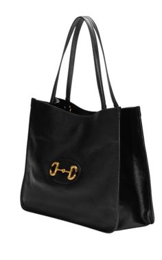 This tote bag from Gucci incorporates heritage details of the brand. Smooth black leatherSignature Horsebit detail at the frontFlat top handlesComposition: Leather 100%, Gold Plated Metal 100%Lining: Cotton 100%Leather strap and magnetic snap closureSize: Height 11.2"/28.5 cm/, Width: 14.75"/ 37.5cm, Depth: 5"/ 12.5cmMade in Italy Tas Gucci, Medium Tote Bag, Gucci Tote Bag, Bags Gucci, Gucci Horsebit, Gucci Tote, Tote Bag Black, Original Bags, Medium Tote