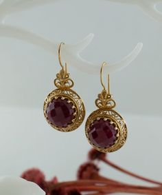 Gold Ruby Corundum Vintage Silver Drop Earrings, 925 Sterling Gold Plated Red Gemstone Artisan Handcrafted Victorian Filigree Ornate Jewelry Handmade Earrings, Birthday gift, Anniversary gift, one of a kind, antique earrings jewelry Material: 925 Sterling Silver with Gold Plated ( NICKEL FREE ) Length and Width: 3.8cm X 1.9cm // 1.5 Inches X 0.75 Inches Gemstone: Ruby Corundum 12 mm. These red stone earrings add a bold fashion statement to any look. The handcrafted designs that make a beautiful Ruby Jewelry With Matching Earrings For Gift, Ruby Jewelry With Matching Earrings As A Gift, Ruby Jewelry Set With Matching Earrings As A Gift, Antique Round Filigree Earrings, Antique Filigree Earrings, Victorian Filigree Round Earrings, Handmade Ruby Fine Jewelry, Victorian Round Filigree Earrings, Formal Ruby Gemstone Earrings