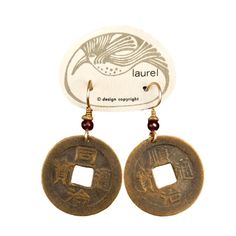 Crafted from antique Qing Dynasty bronze coins, these earrings are sure to bring you luck. Bronze coin, gold-plated brass french ear hook with glass bead accent. About 1.75" tall. The revival earrings here are vintage from the 1970's - they were designed by Laurel Burch and crafted by hand. These earrings were made using gold plated brass. Vintage Coin Pendant Jewelry For Good Luck, Vintage Good Luck Coin Pendant Jewelry, Brass Medallion Earrings For Pierced Ears, Coin Pendant Medallion Earrings For Gift, Brass Coin Pendant Medallion Earrings, Antique Bronze Round Earrings, Brass Medallion Earrings With Coin Pendant, Vintage Brass Jewelry For Good Luck, Nickel-free Brass Medallion Earrings