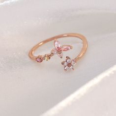 📌 Please Note: When adjusting the ring, please squeeze or expand the ring body slowly and gently. 💎 Materials: 14k Rose Gold Electroplated - more durable than regular platings Cubic Zirconia 📐 Size: Adjustable Open Design - Size 5+ Dainty Adjustable Rose Gold Ring, Adjustable Rose Gold Cubic Zirconia Rings, Dainty Adjustable Rose Gold Diamond Ring, Adjustable Dainty Rose Gold Diamond Ring, Adjustable Rose Gold Toe Ring, Adjustable Rose Gold Midi Rings For Promise, Adjustable Rose Gold Flower Toe Ring, Adjustable Rose Gold Flower Ring For Anniversary, Rose Gold Open Ring For Promise