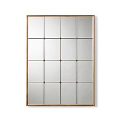 a mirror that is on the wall with some squares in it and one side missing