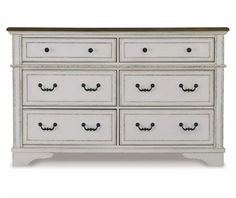 a white dresser with drawers and knobs on the bottom drawer, against a white background