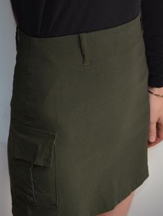 Cool vintage skirt made of stetchy, matte fabric in army green tone. Mini length, high waisted pencil fit. Belt loops. Cargo pocket on the side. Closes with hidden zip on the back. Era: 90's Fabric: 64% polyester, 30% viscose, 6% elasthane Condition: very good Estimated size: S (please, check the measurements) Measurements (measured flat, need to be doubled to get the circumference): Waist (unstretched): 32 cm / 12,6 inches Hips: 42 cm / 16,5 inches Length: 40 cm / 15,7 inches Stretch Mini Cargo Skirt With Pockets, Fitted High Waist Mini Skirt With Cargo Pockets, Fitted High Waist Cargo Skirt With Side Pockets, Fitted Mini Skirt With Cargo Pockets, High Waist Fitted Khaki Cargo Skirt, Fitted High Waist Khaki Cargo Skirt, Fitted Utility Mini Skirt With Side Pockets, Fitted High Waist Skort With Cargo Pockets, High-waist Khaki Mini Skirt With Pockets