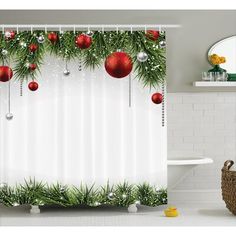 a christmas themed shower curtain with ornaments hanging from it's sides and greenery on the outside