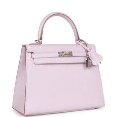 This Kelly, in the Sellier style, is in Mauve Pale epsom leather with palladium hardware and has tonal stitching, two front straps with toggle closure, clochette with lock and two keys, single rolled handle and removable shoulder strap.The interior is lined with Mauve Pale chevre leather and has one zip pocket with an Hermes engraved pull and one open pocket on the opposite side.Collection: UOrigin: FranceCondition: New and never worn (plastic on hardware)Accompanied by: Hermes box, dustbag, clo Hermes Kelly Pink, Pink Kelly Bag, Hermes Collection, Hermes Kelly Sellier, Pink Kelly, Kelly Sellier, Cotton Candy Colors, Hermes Kelly Bag, Luxury Bags Collection