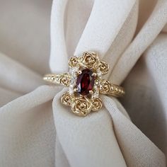 "Life's Beauty in Bloom: Peonies Oval Diamond Ring" Indulge in the exquisite elegance of our Peonies Oval Diamond Ring, a stunning bouquet of sculpted peonies and petals. This ring is not just an accessory but a reminder of the sheer beauty of life, encapsulated in a work of art. At its heart, it features a natural maroon red garnet, adding a touch of rich and romantic charm to the design. Handcrafted in our NYC studio, this ring is a masterpiece that captures nature's beauty and the enduring sp Bouquet Ring, Beautiful Peonies, Elegant Wedding Rings, Wedding Engagement Rings, Cute Engagement Rings, Nyc Studio, Future Engagement Rings, Beauty Of Life, Fancy Necklace