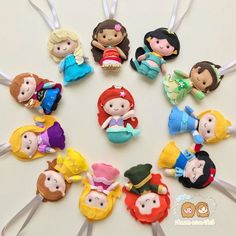 there are many little princesses on the toothpicks in this circle, each with different hair colors