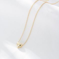 A gleaming heart of 18-karat gold anchors this chain necklace that makes a meaningful gift for a loved one. Hand-crafted using 18K gold plated sterling silver. - Care Instructions: Avoid contact with water, lotion, and perfume. Clean gently with a polishing cloth. Product Specifications: - 18K gold plating over .925 Sterling Silver - Hypoallergenic - Cubic Zirconia crystals Perfume Clean, Gold Heart Necklace, Sweet Heart, Fine Jewellery Earrings, Trendy Jewelry, Gold Plated Sterling Silver, Meaningful Gifts, Gold Plating, Lobster Claw