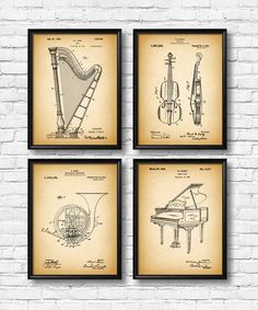 four vintage musical instruments and piano blueprinted on parchment paper, hanging on a brick wall