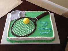 a birthday cake with a tennis racket and ball on it