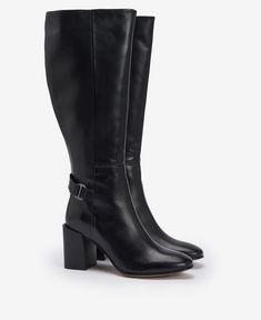 Take your outfit from day to night with the Barbour Saskia Knee-High Boots. Crafted from buttery leather, this style is sat atop a sophisticated block heel for elegance and comfort in one. Detailed with a branded buckle to the ankle and wrap-around strap, they are perfect for dressing up any outfit. Elegant Wide Calf Boots With Stacked Heel, Elegant Boots With Stacked Low Heel, Elegant Square Toe Block Heels For Fall, Luxury Boots With Stacked Block Heel, Wide Calf Heeled Boots With Stacked Block Heel, Classic Heeled Boots With Stacked Heel And Almond Toe, Formal Calf Leather Boots With Stacked Heel, Classic Heeled Boots With Stacked Heel For Office, Chic Heeled Boots With Leather Sole, Medium Width