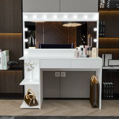 a white vanity with lighted lights and a purse