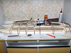 there is a model boat on the counter