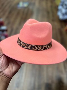 This is a true head turner for the fall. The vibrant peach wide brim hat with a leopard band is a winner. A must have,  you can't go wrong. Don't delay order yours today. Winter Fedora, Colorful Hats, Formal Hat, African Hats, Colorful Hat, Church Hat, Wide Brim Fedora, Church Hats, Casual Hat