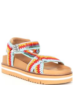 From Chelsea & Violet, the Koa Woven Footbed Sandals feature:Woven fabric upperHook-and-loop and buckle designCushioned footbedSynthetic liningSynthetic outsoleApprox. 2" platform heightImported.