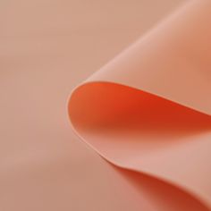 an orange and pink background with curved edges