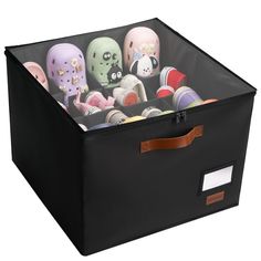 a black storage box filled with lots of toys