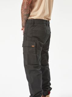 The Workwear Caliper Cuff Pants perfectly blend durability with comfort. They are made from a tough cotton-nylon-elastane stretch canvas with reinforced stress points to maintain the fit. The tapered leg and ankle cuff makes them easy to wear with any footwear your job requires, while multiple pockets keep all those on-the-job essentials close at hand. With Volcom Workwear’s signature style and robust construction, these pants are durable enough for the toughest jobs but stylish enough for every Backyard Ramp, Cuff Pants, Surfing Swimwear, Cuffed Pants, Snow Jacket, Work Pants, Calipers, Swimwear Tops, Modern Fit