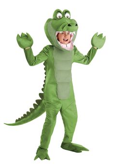 a child in a green alligator costume with his mouth open and hands out to the side