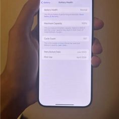 someone is holding up their iphone to check out the health information