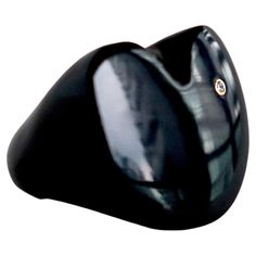 An exquisite ring made in black onyx stone adorned with a beautiful diamond in a 14k solid bezel Available sizes: 5.0, 5.5 , 7.0 Please message us specifying your ring size when purchasing. Dimensions: width - 29mm Height - 27mm Style Details The stone is intricately carved by hand, making it a truly one-of-a-kind ring. Each ring will be slightly different than the one pictured. Given the width of the ring’s band, you should consider sizing up. Please note that rings cannot be resized after purc Classic Black Spinel Diamond Ring For Formal Occasions, Classic Black Diamond Ring Gift, Luxury Onyx Diamond Ring For Formal Occasions, Classic Black Diamond Ring For Gift, Classic Black Diamond Ring As A Gift, Modern Black Rings For Formal Occasions, Elegant Black Diamond Ring With Vvs Clarity, Classic Formal Black Diamond Ring, Sleek Black Jewelry For Formal Occasions