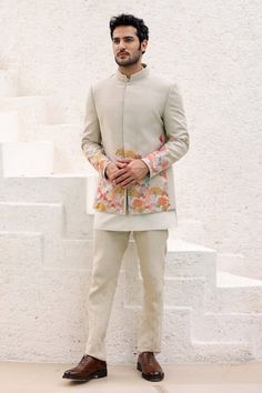 Beige bandhgala highlighted with resham floral embroidery. Paired with a short kurta and trouser.
Components: 3
Pattern: Embroidered
Type Of Work: Resham
Neckline: Band collar
Sleeve Type: Long
Fabric: Pure Linen
Color: Beige
Other Details: 
Approx. product weight: 1.3 kgs
Occasion: Mehendi and Puja - Aza Fashions Best Marriage Outfits For Men, Beige Jodhpuri Suits For Men, Long Jodhpuri For Men, Kurta With Blazer For Men, Jhodpuri Suit For Men Wedding, Engagement Kurta For Men, Short Sherwani For Men, Beige Bandhgala, Short Sherwani