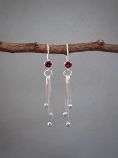 "These beautiful dangle sterling silver earrings add a stylish glow to any outfit. They feature faceted genuine garnet. The three droplets dangle from the small circle. The earrings are polished to a bright finish. Garnet is the birthstone for the month of January. The total length: approximately 4.2 cm (1.6\") Width: 4 mm Garnet: 4 mm The earrings will come in a beautiful gift box. * CHECK OUT MORE JEWELLERY * www.etsy.com/shop/kailajewellery" Dangle Stud Earrings, Sterling Silver Linear Earrings With Dangling Beads For Gift, Silver Drop Earrings Simple, Garnet Birthstone, Star Garnet, Handmade Silver Jewellery, Wedding Bridesmaid Jewelry, Spike Earrings, Small Circle