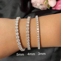 "Product: Moissanite Iced out Unisex Tennis Bracelet in Sterling Silver Metal: Sterling Silver with 925 stamped Stone Weight: 3mm-0.11ct each stone 7\" 50pcs 3mm Moissanite about 5ctw 7.5\" 54pcs 3mm Moissanite about 5.4ctw 8\" 60pcs 3mm Moissanite about 6.0ctw 4mm-0.3ct each stone 7.25\" 40pcs 4mm Moissanite about 12ctw 7.5\" 45pcs 4mm Moissanite about 13.5.0ctw 8.25\" 51pcs 4mm Moissanite about 15.3ctw 5mm-0.5ct each stone 7.25\" 5mm Moissanite 36PCS about 17.5ctw Package: Elegant gift box is Luxury Moissanite Tennis Bracelet For Anniversary, Diamond White Sterling Silver Round Bracelet With Prong Setting, Hand Set Diamond White Sterling Silver Bracelet, Brilliant Cut Sterling Silver Tennis Bracelet, Sterling Silver Tennis Bracelet Vvs Clarity Round Cut, Sterling Silver Tennis Bracelet In Diamond White, Sterling Silver Diamond White Tennis Bracelet, Sterling Silver Hand Set Tennis Bracelet, Silver Diamond Tennis Bracelet