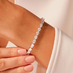 13.50 CT Oval Cut Moissanite Tennis Bracelet / 14K Solid Gold Simulated Diamond Bracelet / 4.00 mm x 6.00 mm Oval Cut Bridal Bracelet The Oval Cut Moissanite Tennis Bracelet features oval-cut moissanite stones, each weighing  0.50 carats. These stones are precision-cut to dimensions of 4.00 mm x 6.00 mm, ensuring uniformity in size and shape. The stones are securely held in place by prong settings crafted from 14k solid gold. The use of solid gold not only adds a luxurious aesthetic but also pro Luxury Oval Cubic Zirconia Bracelets, Luxury Oval Tennis Bracelet With Prong Setting, Luxury Timeless Oval Diamond Bracelet, Luxurious Aesthetic, Wedding Jewelry Bracelets, Ethical Jewelry, Bridal Bracelet, Recycled Gold, Wedding Bracelet