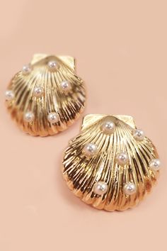 These earrings feature exquisite seashells delicately accented with lustrous pearls, evoking the serenity of the beach. Earrings are a final sale item Elegant Pearl Drop Mother Of Pearl Shell, Elegant Mother Of Pearl Shell With Pearl Drop, Elegant Shell With Pearl Charm, Elegant Mother Of Pearl Shell, Summer Pearl Earrings For Pierced Ears, Summer Pearl Earrings, Elegant Pearl Earrings For The Beach, Elegant Pearl White Shell For Beach, Shell-shaped Pearl Earrings With Pearl Charm