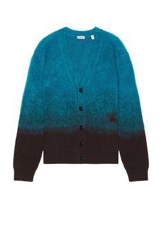 Find BURBERRY Chest Logo Cardigan In Blue on Editorialist. Burberry Chest Logo Cardigan in Blue Self: 53% wool 32% mohair 15% polyamide Trim: 44% wool 38% mohair 185 polyamide Cuff: 98% wool 1% polyamide 1% elastane. Made in Italy. Dry clean only. Buffalo horn buttons. Fuzzy knit fabric. BURF-MK64. 8093631. About the designer: Founded in 1856, Burberry’s legacy as a pillar of British style grew from Thomas Burberry’s most iconic innovation: the gabardine trench coat. Upholding the pioneering spirit of his predecessor, current creative director Riccardo Tisci brings a fresh and irreverent approach to the house’s quintessentially British vision of luxury. Marrying technology, artistry, and tradition, the label touts a range of casual-wear and eveningwear that embodies a progressive femininit Designer Wool V-neck Outerwear, Blue Wool V-neck Outerwear, Blue Wool Cardigan For Fall, Luxury Wool V-neck Outerwear, Luxury Blue Sweater For Workwear, Luxury Blue Sweater For Work, Blue Cashmere Cardigan For Fall, Luxury Blue Wool Sweater, Blue Cashmere Outerwear For Fall