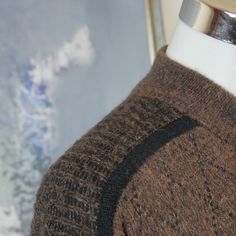 "This 1980s Italian vintage sweater is a warm brown color with a burgundy argyle pattern across the front and back and accented with black fine striping. The wool-mohair blend pullover has a short V neckline with a wide ribbed crossover collar. The sweater has ribbed cuffs and a ribbed waistband. Note that this is a \"short\" size. See especially the sleeve length and sweater length below. Brand label: Nani Bon Size: 46S (US/UK) Material: 40% acrylic, 30% wool, 20% mohair, 10% nylon Chest = 46 i Retro Brown Crew Neck Sweater, Vintage Brown Sweater For Layering, Retro Brown Wool Sweater, Vintage Pullover, Pullover Sweater Men, Argyle Pattern, Sweater Brown, Brand Label, Vintage Sweater