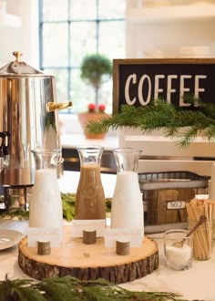 the coffee is being served on the table in front of the sign and other items