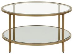 a round glass table with metal legs and a gold frame around the top, against a white background