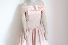 "Off-shoulder evening dress in light pink, powder pink shade. Made in U.S.A. Fantastic and voluminous ballroom gown with a corset bodice. Vintage from the 80's inspired from the ballroom gowns of the 40's and 50's. The bodice part is lightly boned, and decorated with a layered off the shoulders cape with rose. Very light coloured, soft pink brocade fabric, with shimmering floral pattern. Scott Mcclintok, a line off Jessica McClintock ythe designer well-known fromm her line Gunne Sax. Tea-length dress. The skirt part is underlined with an abundance of white tulle. Bustier style bodice. Rich, baroque style brocade material. CONDITION: Outside is flawless, no stains or holes are present.                      The inner lining of the bodice has some discolouration, and slight fraying near to th Pink Brocade, Ballroom Gowns, Off Shoulder Evening Dress, Pink Powder, Sublimation Ideas, Corset Bodice, Pink Shade, Ballroom Dress, Jessica Mcclintock