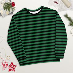 Treat yourself or a loved one to the ultimate cozy wardrobe staple! This black and green striped shirt is made from a soft and durable material that feels great to wear. Plus, the inside's brushed fleece gives an extra comfy feel.  Whether you're running errands or having a relaxing night in, this crewneck sweatshirt is the perfect gift for any woman.  Get your hands on it now and experience true comfort and style! ⚠️ PLEASE NOTE: ⚠️ 🎅🏼 To ensure that your package has the best possible chance of arriving in time for 🎄Christmas: ⭐️ For deliveries to the United States, please order before December 11th; ⭐️ For deliveries to Europe, please order before December 14th. ✨ SPECIFICATIONS ✨ * 95% recycled polyester, 5% spandex * Fabric weight (may vary by 5 9.08 oz./yd.² (308 g/m²) * Soft cotto Winter Striped Relaxed Fit Sweatshirt, Striped Relaxed Fit Sweatshirt For Winter, Oversized Striped Crew Neck Sweatshirt, Oversized Striped Sweatshirt With Crew Neck, Striped Crew Neck Sweatshirt For Streetwear, Striped Relaxed Fit Sweatshirt For Streetwear, Green Crew Neck Tops With Contrast Stripes, Green Crew Neck Top With Contrast Stripes, Oversized Striped Long Sleeve Sweatshirt