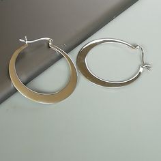 These are sterling silver flat hoops. Dimensions: 40 x 44 mm These earrings are made of 925 hypoallergenic sterling silver. Please note this price is for ONE PAIR Sent in a gift box. I can include a personal message from you if needed You are welcome to contact me at... bhavnakwintra1956@gmail.com For more beautiful pieces from my shop, please browse 👇 TOE RINGS: https://www.etsy.com/your/shops/TheSilverGame/tools/listings/section:27020628,view:table EAR HOOPS: https://www.etsy.com/your/shops/T Modern Silver Hoop Earrings, Modern Sterling Silver Hoop Earrings With Simple Design, Modern Silver Hoop Earrings With Simple Design, Silver Hypoallergenic Open Circle Hoop Earrings, Silver Hypoallergenic Hoop Earrings, Modern Sterling Silver Round Hoop Earrings, Hypoallergenic Silver Open Circle Hoop Earrings, Silver Sterling Hoop Earrings With Simple Design, Minimalist Silver Metal Hoop Earrings