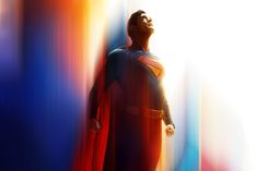 a man dressed as superman standing in front of a colorful wall with his eyes closed