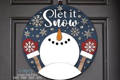 a door hanger that says let it snow