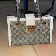 Beige Cream Authentic Gucci Padlock Small Shoulder Bag Purse With Gold Hardware There Are Signs Of Wear Throughout The Bag: Red Ink Inside Bag, Hardware Shows Sign Of Wear, Some Part Of The Beige/Cream Part Of The Bag Shows Marks **** Does Not Come With Key With Leather Holder (Not Pictured) Quick Shipping. Priced At $500 To Reassure For Authenticity, But Accepting Reasonable Offers Currently Retails For: $2300 Beige Gucci Bag With Turn-lock Closure, Gucci Beige Bags With Turn-lock Closure, Gucci Leather Bags With Lock, Gucci Beige Shoulder Bag For Office, White Bags With Lock For Everyday, Chic Gucci Shoulder Bag With Cc Turnlock Closure, Chic Gucci Shoulder Bag With Cc Turnlock, Cream Bags With Cc Turnlock Closure, Chic Beige Bag With Lock