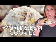 a woman holding a plate with cookies on it and the words world's best cookies