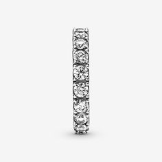 Make a classic statement with the Sparkling Row Eternity Ring. Hand-finished in sterling silver, this eternity ring features a band inlaid with sparkling clear man-made cubic zirconia. The design looks equally beautiful worn solo or stacked with other rings. Style it with bands in similar tones to create a monochromatic look, or go for contrasting metals for a combination that pops. This ring is designed to be a wardrobe essential for years to come. - Pandora Sparkling Row Eternity Ring - Sterling silver / Cubic Zirconia / Clear - Sz. 7.5 Timeless Silver Half Eternity Jewelry, Classic Sterling Silver Rings With Sparkling Stones, Classic Sterling Silver Eternity Band In Silver, Timeless Silver Jewelry With Half Eternity Detail, Timeless Silver Eternity Band For Anniversary, Timeless Silver Half Eternity Band, Classic Sterling Silver Diamond Ring With Sparkling Stones, Classic Rings With Sparkling Round Cut Stones, Classic Silver Rings With Sparkling Stones