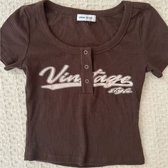 Y2k Brown Baseball Tee From Urban Revival! Never Worn No Flaws New W/O Tags , Size Xs-S Brown Letter Print Top For Summer, Y2k Crew Neck Top With Text Print, Y2k Text Print Crew Neck Top, Brown Y2k Tops With Graphic Print, 90s Fitted Tops With Letter Print, 90s Style Fitted Tops With Letter Print, Brown Y2k Tops For Summer, Brown Cotton Y2k Top, Brown Y2k Style Summer Tops