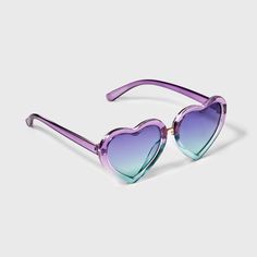 The Girls' Heart Sunglasses by Cat & Jack™ are not only stylish but also make for a functional, essential accessory to add to your collection. Made from recycled plastic, the heart-shaped purple and blue frame adds a pop of vibrant color to your look. The blue lens provides maximum UV protection with a gradient lens feature, making these glasses perfect for any outdoor activity. Cat & Jack™: Kids’ clothing with an imagination of its own. Playful Heart-shaped Sunglasses With Gradient Lenses, Trendy Adjustable Heart-shaped Sunglasses, Adjustable Purple Sunglasses With Gradient Lenses, Playful Heart-shaped Sunglasses With Uv Protection, Trendy Multicolor Heart-shaped Sunglasses, Heart-shaped Plastic Sunglasses With Mirrored Lenses, Heart-shaped Mirrored Sunglasses, Purple Tinted Fun Sunglasses, Fun Purple Tinted Sunglasses